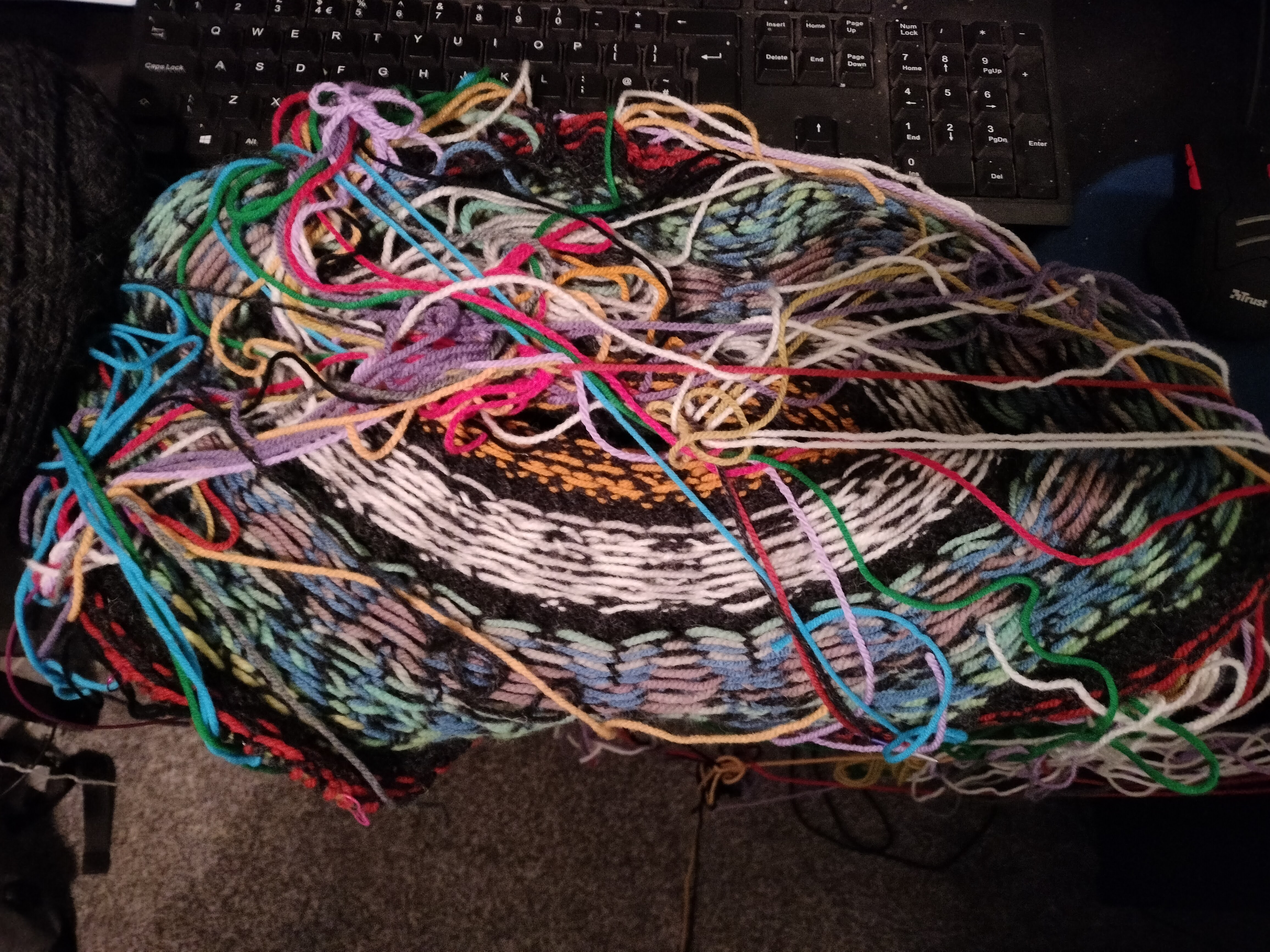 The wrong side of the yoke with the first 3 motifs completed