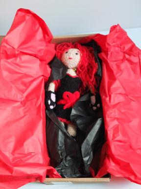 The doll in a shoe box