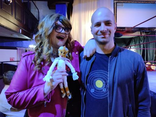 A photo of me standing next to Commander Sterling, who is holding the doll